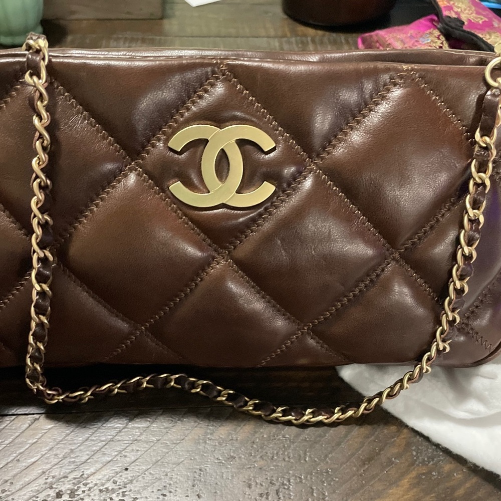 New Chanel Bubble Pochette purse with gold tone & leather straps.